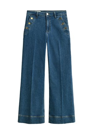 Augsta vidukļa plaša piegriezuma zili džinsa bikses ar priekšējām sānu pogām un priekšējām leņķveida kabatām, tām ir jostas cilpas un šūtas apmales.