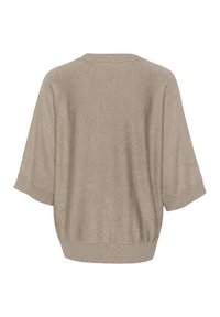 Beige pārāk liels džemperis ar īsām piedurknēm, ribotām aprocēm un apakšmalu, mīksta tekstūra un brīvs piegriezums, demonstrējot vienkāršu, minimālistisku dizainu.