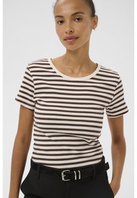 Striped short-sleeve t-shirt in brown and cream, ribbed texture, round neckline, fitted style, paired with black belted trousers.
