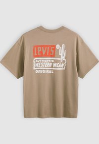 Brown cotton t-shirt featuring a white and red print with the text "LEVI'S," a cactus graphic, and "AUTHENTIC WESTERN WEAR ORIGINAL."