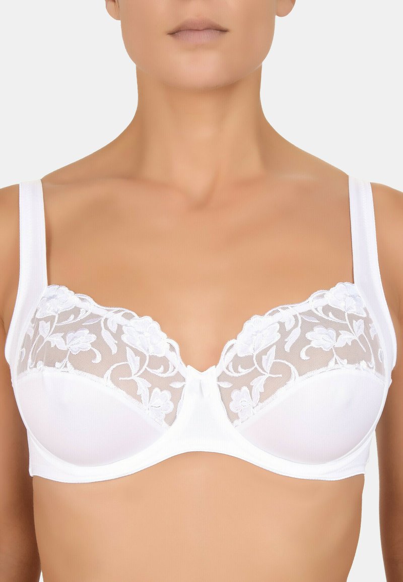 White bra featuring lace trim with floral pattern, sheer mesh cups, and wide adjustable straps. Smooth fabric, hook closure at the back.