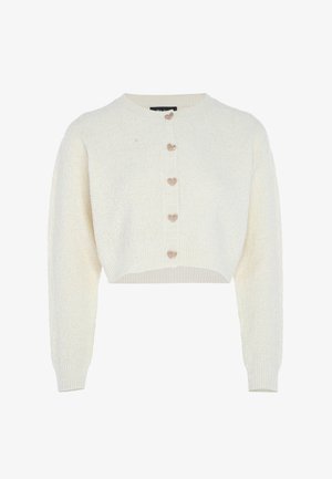 Kort crèmegekleurde cardigan met lange mouwen en vijf decoratieve hartvormige knopen aan de voorkant.