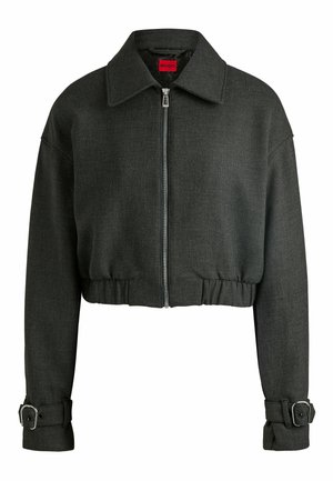 Cropped dark gray jacket with a collared neckline, front zipper, and belted cuffs. Made from textured fabric with a fitted waist.