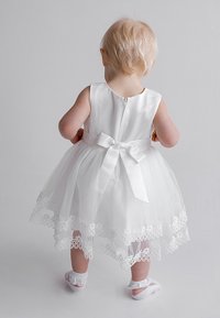 White, sleeveless dress with a satin bodice and layered tulle skirt. Features a lace border and a satin ribbon tied at the waist.