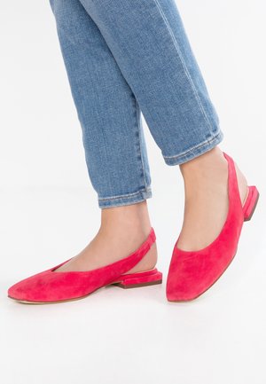 Bright pink suede slingback flats with a pointed toe and low square heel, featuring an open arch design and smooth texture.
