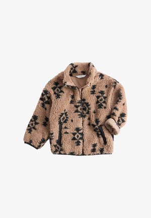 Chaqueta de forro polar marrón claro con patrones geométricos negros, cuello alto, cierre de cremallera en la parte delantera y puños elásticos. Presenta bolsillos laterales y un tacto suave.