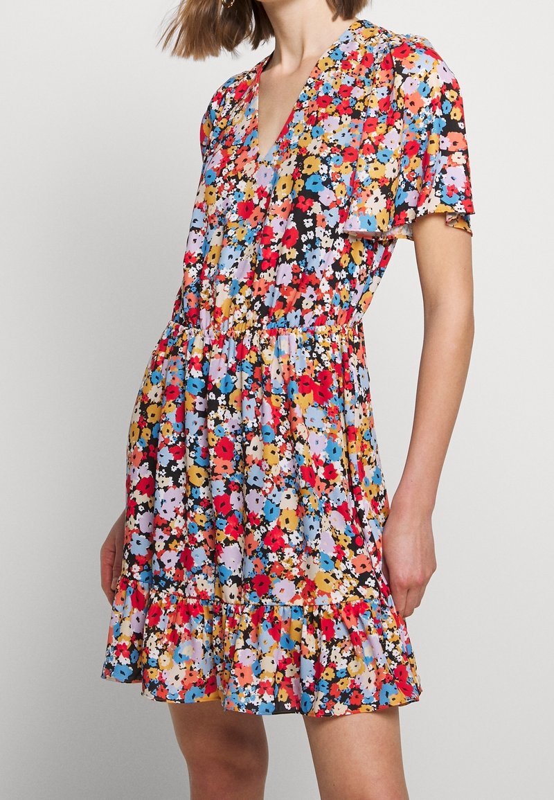 Floral print dress featuring a V-neck, short sleeves, elastic waistband, and a ruffled hem in vibrant colors against a dark background.