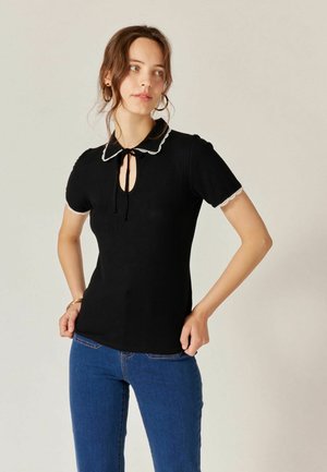 OESTIA - Polo shirt - black