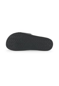 Semelle de chaussure en caoutchouc noir avec un motif de bande de roulement en zigzag et des accents hexagonaux. Présente une impression de logo près de la zone du talon.