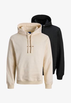 Two hoodies: one cream with a front pocket and light brown text, the other black with a textured finish. Both have drawstring hoods.