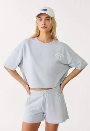 Stradivarius Spodnji deli trenirk - light blue