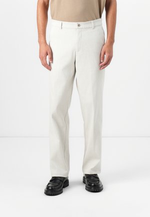 Light beige trousers with a straight cut, button closure, and two side pockets. Made of a textured, breathable fabric.