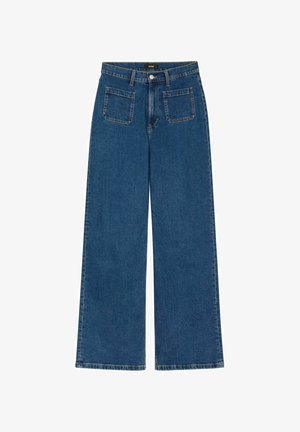 Luźne jeansy o szerokich nogawkach w ciemnym odcieniu niebieskiego. Posiadają zapięcie na guziki, dwie przednie kieszenie oraz dwie tylne kieszenie. Wykonane z wytrzymałej bawełnianej tkaniny.