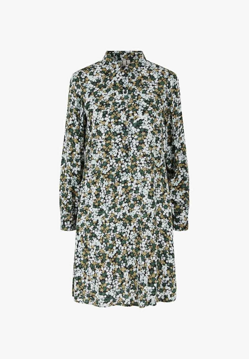 Robe à manches longues avec un motif floral dense vert, blanc et jaune et un petit col montant sur fond blanc.