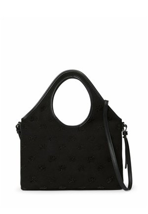 Sac à main noir avec poignées découpées en cercle, motif texturé et une longue bandoulière amovible sur fond blanc.