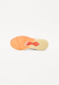 Shoe outsole in rubber; features a textured pattern with orange and yellow accents. Branding visible on the heel section.