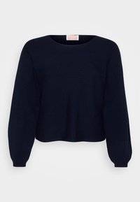 Pull en maille bleu marine avec un col rond, de longues manches bouffantes et des poignets côtelés. Texture douce et coupe décontractée.