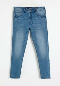 Jasnoniebieskie dżinsy o slim fit, pięć kieszeni i zamek błyskawiczny. Cechują się subtelnym efektem przecierania i blaknięcia w okolicy ud.