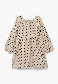 Beige kolektoni vestido con punti neri, maniche lunghe a sbuffo e vita arricciata. Presenta un collo rotondo e una vestibilità ampia.