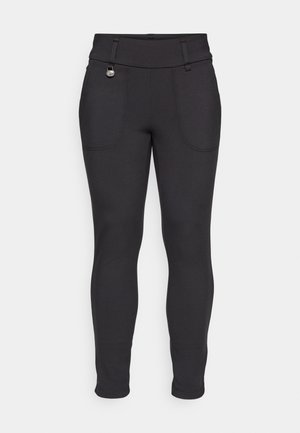 Leggings neri elasticizzati con vita alta, progettati con due tasche frontali e un piccolo dettaglio di hardware decorativo sulla parte anteriore.