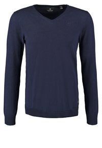 Pull en V à manches longues, couleur bleu marine, avec des poignets et un ourlet côtes, petit logo sur la poitrine et étiquette de la marque à l'intérieur du col.
