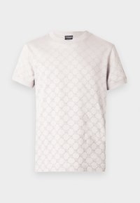 Ανοιχτό γκρι μπλουζάκι με διακριτικό υφασμάτινο μοτίβο, στρογγυλή λαιμόκοψη και κοντά μανίκια. Κατασκευασμένο από μαλακό βαμβακερό υλικό.