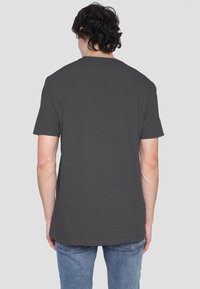 Dark gray short-sleeve t-shirt with a round neckline, made of smooth fabric, featuring a plain back design and structured cut.