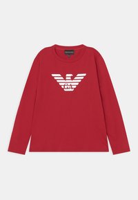 Red long-sleeve T-shirt made of cotton, featuring a white eagle logo with stripe accents. Round neckline and regular fit.