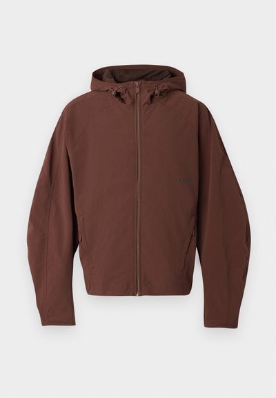 Brown hooded jacket with a full zipper, made of lightweight material, featuring a relaxed fit and seam detailing. No visible logo accents.
