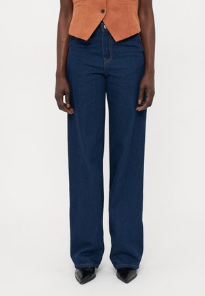 Vide ben med mørk denim med en glatt tekstur, med en klassisk femlommersdesign og høy midje for en avslappet passform.