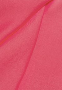 Bright pink fabric with a smooth texture, showing folds and a lightweight, stretchy design. Highlights a uniform, solid color without patterns.