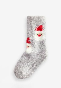 Calza grigia pelosa con una texture morbida, caratterizzata da un design di faccia di Babbo Natale rossa e bianca sul lato e una finitura accogliente e soffice.