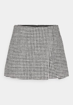 Μίνι φούστα σε ασπρόμαυρη καρό σχέδιο houndstooth, με ίσια γραμμή, κλείσιμο με φερμουάρ στο πλάι και δομημένο ύφασμα. Απλή μαύρη επένδυση.