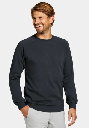 Dunkelblaues Sweatshirt aus weichem Stoff, mit Raglanärmeln, Rundhalsausschnitt und gerippten Bündchen sowie Saum. Texturierte Optik, minimalistische Details.