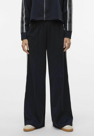 Pantaloni largi marină cu dungi verticale, talie elastică și o textură netedă. Asortați cu un jachetă scurtă cu fermoar.