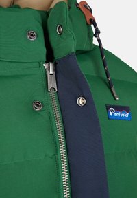 Green puffer jacket with blue accents, a silver zipper, and brown toggle detail. Features a label with a mountain logo. Textured fabric.