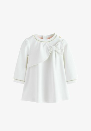 Weißes Baby-Kleid mit langen Ärmeln, großer Schleife auf der Brust und feinen goldenen Verzierungen am Kragen und an den Manschetten.
