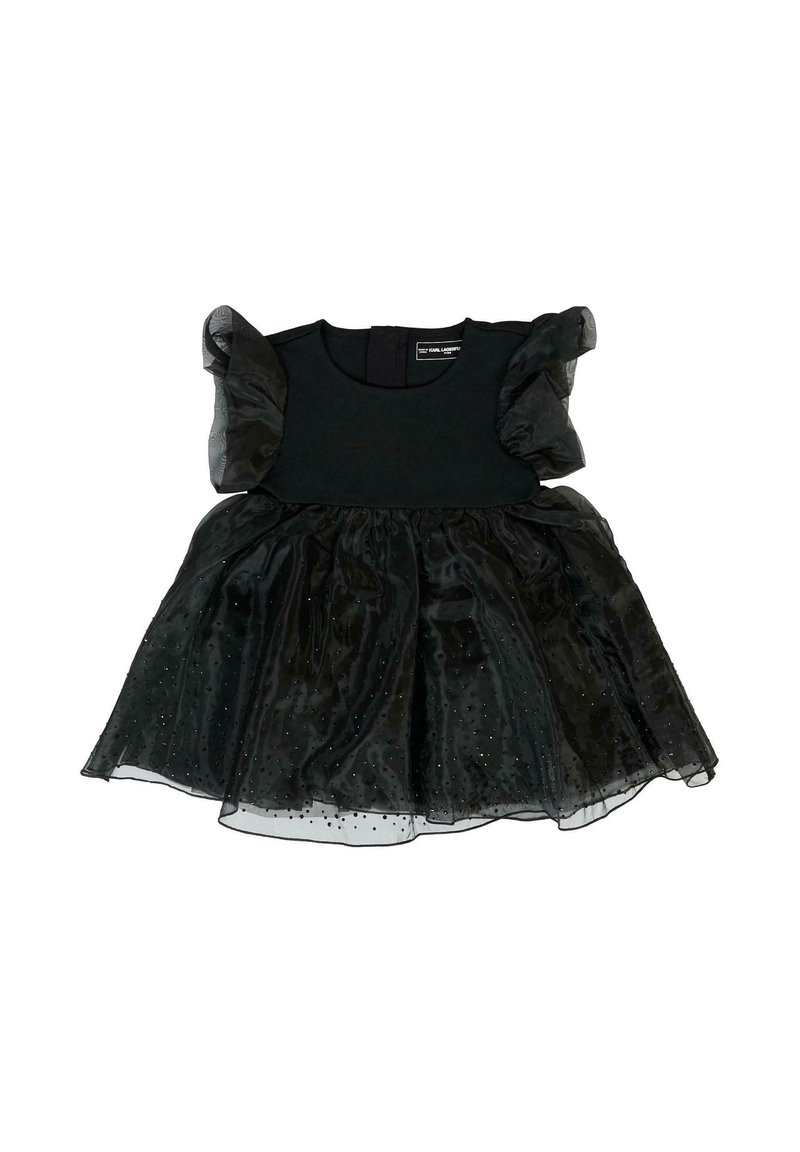 Czarna sukienka z dopasowanym gorsetem i warstwową spódnicą z tiulu. Tkaninę zdobią bufiaste rękawy oraz delikatne kropkowane wzory. Zapięcie z tyłu.