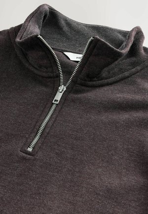 Dark gray pullover with a high collar, featuring a silver zip closure, soft fabric, and a smooth texture.