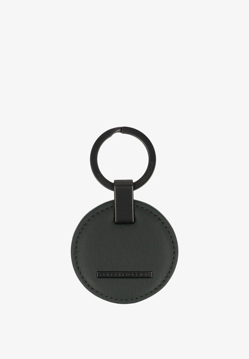 Llavero redondo de cuero negro con anilla metálica negra y placa con el logotipo "Porsche Design" en el centro frontal.