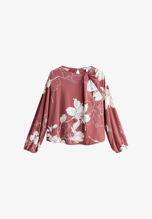 Rose-colored long-sleeved blouse with white floral prints. Features a keyhole neckline and gathered cuffs, made of smooth fabric.
