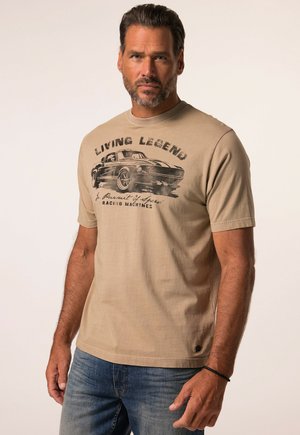 Beige cotton t-shirt featuring a vintage car graphic in black, with "LIVING LEGENDS" text above. Short sleeves, crew neck, casual fit.