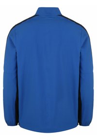 Blauwe jas met contrasterende zwarte zijkanten. Beschikt over een kraag, lange mouwen en een rechte zoom. Gemaakt van een gladde stof.