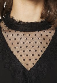 Vero Moda Koktejlové šaty / šaty na párty - black