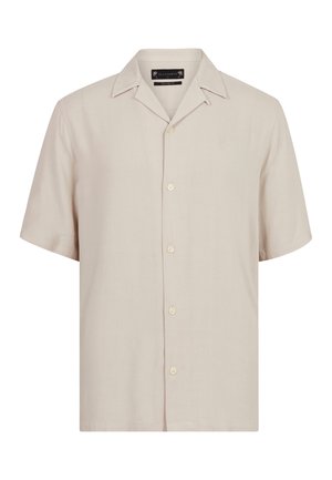 Kortærmet skjorte i lys beige stof med klassisk krave, seks knapper ned langs fronten og et diskret broderet logo på brystet.