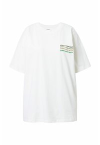Camiseta de algodón blanca con mangas cortas, un corte relajado y texto verde que dice "NO MIRES ATRÁS" en la zona izquierda del pecho.