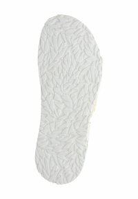 Sottopiede con una base in gomma bianca texturizzata, caratterizzato da un motivo di forme angolari disposte in un design casuale sulla superficie.