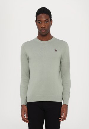 Light green knit sweater with a crew neckline. Features a small embroidered logo on the chest. Fitted cuffs and waistband.