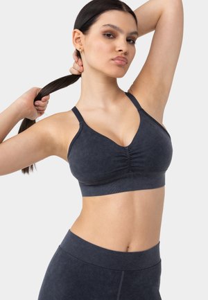 MARBLE SEAMLESS - Light support sports bra - black
