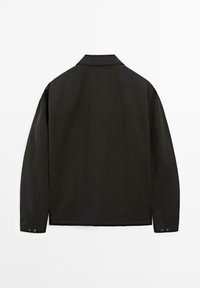 Black jacket featuring a classic collar, long sleeves with buttoned cuffs, and a plain texture. Back view shows simple stitching details.